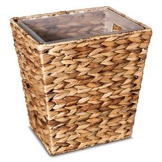 a basket that is made out of wood and has a glass top in the middle