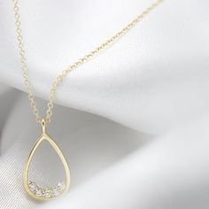 "Dainty and unique Diamond necklace Set with five sparkling 1.5 mm Diamonds VS-E 0.075 ctw inside a pear shaped gold pendant. Handmade by an inspired jewelry artist team with decades of experience in the craft of jewelry making. Each gemstone, each diamond is carefully picked. Using only the finest raw materials and the highest industry standard in manufacturing, design and finish. A beautiful vintage inspired piece handmade just for you. All ring sizes available, if you cannot find your ring si Delicate Teardrop Diamond Necklace, Teardrop Diamond Necklace With Delicate Chain, Delicate Teardrop Diamond Necklace For Anniversary, Dainty Diamond Necklace With Teardrop Accents, Dainty Teardrop Diamond Necklace With Accents, Delicate Teardrop Diamond Necklace With Delicate Chain, Minimalist Teardrop Diamond Necklace With Accents, Dainty Teardrop Diamond Necklace For Anniversary, Unique Diamond Necklace