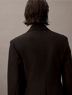 A tailored piece with a structured silhouette, this blazer is wrinkle-resistant and crafted with 4-way stretch for ease of movement. Detailed with crisp notch lapels and made with a single button closure. Finished with seaming details along the sleeves and back.  Material: 66% Polyester, 31% Viscose, 3% Elastane. Sleek Single Button Blazer Dress For Formal Occasions, Sleek Structured Blazer For Semi-formal Occasions, Tuxedo-style Structured Blazer With Double Buttons, Tuxedo Style Structured Blazer With Double Button Closure, Tuxedo Style Structured Blazer With Double Button, Tailored Blazer Dress With Pressed Crease And Lapel Collar, Tailored Tuxedo Blazer Dress With Lapel Collar, Sleek Business Blazer Dress With Suit Collar, Sleek Blazer Dress With Suit Collar For Business