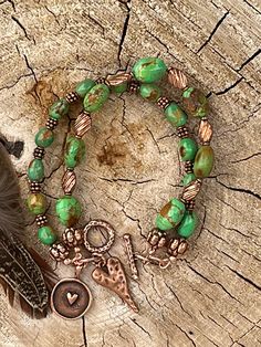 Gorgeous green Mojave turquoise double strand bracelet with copper beads and toggle clasp. Double Bracelet, Turquoise Double Strand Bohemian Jewelry, Green Bohemian Double Strand Jewelry, Green Bohemian Bracelets With Patina, Multi-strand Beaded Turquoise Jewelry, Adjustable Multi-strand Turquoise Beaded Bracelets, Bohemian Turquoise Braided Bracelets, Resizable, Purple Beaded Bracelets, Paper Bead Jewelry