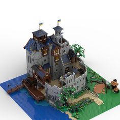 a lego model of a castle on top of a blue mat