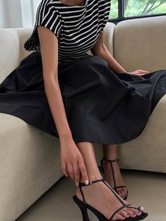 Classic mid-calf length flared and pleated skirt. Voluminous style. Oversized A line skirt. Model is in MINUSEY S. ✔️ Free worldwide express shipping over $100✔️ Loved by 6,500+ customers✔️ Limited edition collections, maximum style⠀⠀⠀⠀⠀⠀⠀⠀⠀Stay ahead of the trend with can’t-find-anywhere-else staples. Your closet will thank you 💕 * MINUSEY S = EU 34, US 2* MINUSEY M = EU 36, US 4* 100% Polyester* Dry clean* Made in Korea - Model Height: 172cm/5'7" (US2, EU34) Summer Evening Skirt With Pleated Waist, Black A-line Maxi Skirt For Summer, Summer Evening Flared Skirt, Evening Flared Skirt For Summer, Summer Evening Full Skirt, Chic Voluminous Pleated Skirt For Summer, Full Skirt For Summer Evening, Summer Evening Maxi Skirt With Gathered Details, Summer Evening Gathered Maxi Skirt