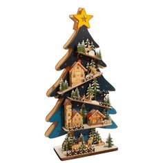 a wooden christmas tree with houses on it