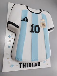 a cake that is shaped like a soccer jersey and has the number ten on it