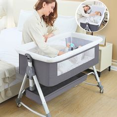 a woman standing next to a baby in a crib on a bed with a night stand