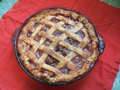 a pie sitting on top of a red cloth