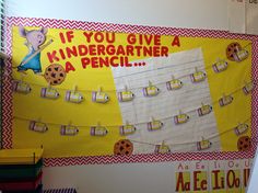 a bulletin board with writing and pictures on it that says if you give a kindergartine a pencil