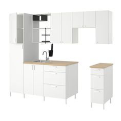 a kitchen with white cabinets and wooden counter tops, including a sink and cupboards