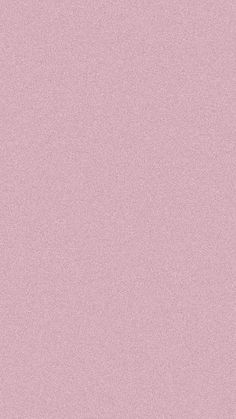 a pink wallpaper background with small white dots on the top and bottom corner,