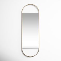 a mirror hanging on the wall next to it's reflection, with a white background