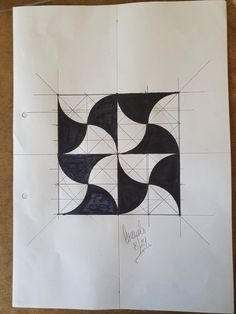 a piece of paper with some black and white designs on it