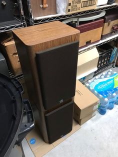 there are many boxes and speakers on the floor