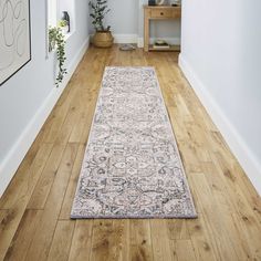 a long rug on the floor in a hallway