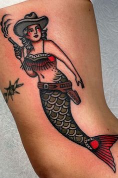 Western tattoos embody the spirit of the wild west, with designs that speak to freedom, adventure, and the rugged beauty of the American landscape. See our full gallery of tattoos to get inspired for your next piece! Photo Credit: Instagram: sarahcarrtattoos American Traditional Mermaid Tattoo, Rick Tattoo, Traditional Mermaid, Small Traditional Tattoo, Tattoo American Traditional, Tattoos Illustration