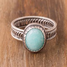 Exuding power an oval of sky blue amazonite is framed by sterling silver. Peruvian artisan Carlos Yauri creates this cocktail ring which circles the finger with an openwork sterling band. Soldered Jewelry, Amazonite Ring, Soldering Jewelry, Unique Bands, Silver Spinner Rings, Filigree Earrings, Sterling Silver Filigree, Single Stone, Ring Oval