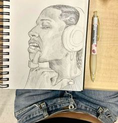 a pencil drawing of a man with headphones on his ears and holding a pen