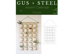 a calendar hanging on a wall with the words gus + steel in it's center