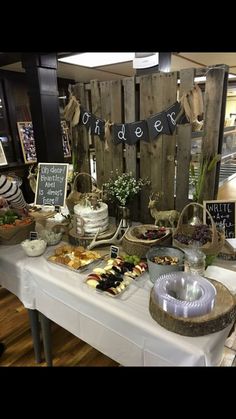 a table filled with lots of food and desserts