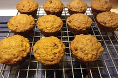 twelve muffins cooling on a wire rack in the oven, ready to be eaten