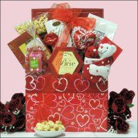 a valentine's day gift basket with chocolates and candy