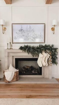 a living room decorated for christmas with stockings on the fireplace