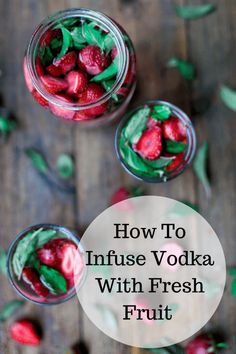 two glasses filled with fruit and topped with whipped cream, mint leaves and strawberries