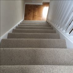 the carpeted stairs in this house are clean and ready for us to walk down