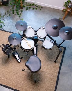 a drum set sitting on top of a rug