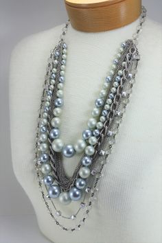 "Vintage Pearl Necklace Multi Strand Statement Gray Silver Layered Bridal Wedding Jewelry. I have mixed a vintage light gray/silver pearl beaded multi strand necklace with vintage and new silver chain necklaces and a vintage crystal necklace for some added sparkle. This necklace has a drop of 17\". It is a classic you will wear again and again! It would be great for a Mother's Day gift or a gift for yourself! International buyers welcome just contact me first for shipping charges." Vintage Silver Necklace, Vintage Pearl Necklace, Multi Strand Beaded Necklace, Pearl Necklace Vintage, Vintage Pearl, Wedding Bridal Jewellery, Chain Necklaces, Vintage Pearls, Multi Strand Necklace