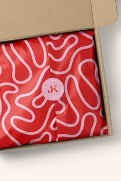 an open box with red and white designs on it