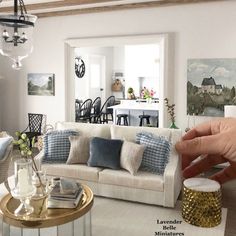 a living room filled with furniture and a chandelier