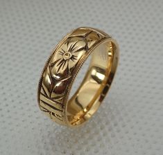 "Return Policy: If the item is as described on the listing, there's a $35.00 charge for the postage and handling that will be deducted from the refund.    Style: TEB111 Some of our jewelry is ready to send out within one or two days. Email and ask us about this listing. We make this wheat pattern wedding band in 14k and 18k white, rose and yellow gold.  The Band is hand carved all the way around and high polished.  It is around 6 mm wide and 1.5 mm thickness with a very comfort-fit edges.  We ca Carved Gold Wedding Band, White Gold Wedding Rings With Hallmarks, Heirloom Jewelry With Decorative Band For Formal Occasions, Classic Yellow Gold Jewelry For Ceremonial Wedding, Formal Heirloom Jewelry With Decorative Band, Classic Ceremonial Jewelry With Decorative Band, Classic Jewelry With Polished Finish For Marriage, Luxury 14k Stamped Round Band Wedding Ring, Antique Diamond Cut Jewelry For Ceremonial Occasions