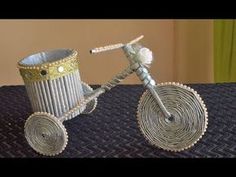 a bicycle made out of yarn sitting on top of a bed