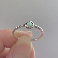 *  Silver Lab White Opal Full Moon Ring, Dainty Ring, Moon Ring, Opal Ring, Boho Ring, Sky Ring Statement Ring, Love Ring, Boho Ring, Delicate Ring, Round Ring, may wear as midi, pinky or thumb ring, 925 Stamped *  White opal is a calming and protective stone, absorbing negative emotions and bringing a sense of peace to an overactive mind *  Perfect gift idea for any occasion: birthday, anniversary, engagement, graduation, bridesmaid, Mother's Day, Valentine's Day, Christmas, promise. *  Your pu Simple Design Crystal Ring As Gift, Simple Design Crystal Ring Gift, Simple Design Round Crystal Ring As Gift, Simple Design Round Crystal Ring Gift, Simple Design Round Crystal Ring For Gift, Silver Midi Rings With Birthstone, Silver Round Midi Rings With Birthstone, Spiritual Adjustable Opal Ring, Adjustable Round Opal Ring, Spiritual Style