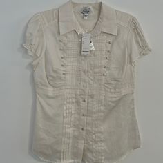 Bebe Geneva Blouse Size L Nwt Its A Bit Sheer And Breathable Off White Button-up Top For Summer, Fitted Cream Shirt, White Fitted Feminine Shirt, Fitted Feminine White Shirt, Fitted Off White Short Sleeve Tops, Off White Button-up Spring Top, Off White Button-up Top For Spring, White Fitted Top With Button Closure, Fitted White Top With Button Closure