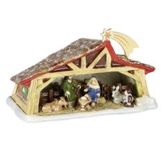 a nativity scene is shown with figurines in the shape of a barn