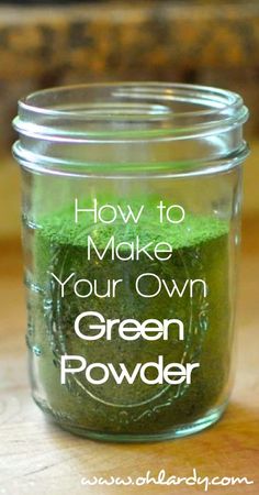 a jar filled with green powder sitting on top of a table