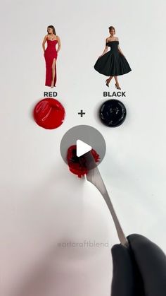 a person is holding a spoon with red and black paint on it, as if they were trying to decide which one