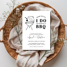 a bbq wedding card on top of a wicker basket