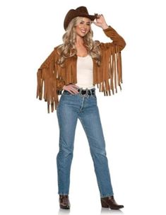 a woman wearing a cowboy hat and fringed jacket is standing with her hands on her hips