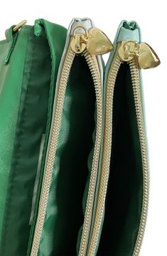 Our color combo "Electric Emerald" — shades of emerald green, aqua, and cool mint — reminds us of vintage cars and electric guitars. This lightning bolt Romy bag comes in clutch when you need somewhere cute to carry your essentials for a night out on the town or a day strolling the city. Our unique 4-section gold chain lets you change up how you wear the Romy — as a crossbody, shoulder bag, wristlet, or size-inclusive waist bag (fits sizes XS through 5X), or remove the chain and carry it as a st Green Travel Clutch Bag, Green Clutch Bag For Travel, Green Pouch Shoulder Bag With Zipper Closure, Green On-the-go Clutch Bag, Green Travel Bag With Zipper Pouch, Retro Green Pouch Bag, Green Clutch Bag For On-the-go, Green Clutch With Zipper Closure, Green Clutch Bag With Zipper Closure