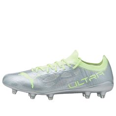 the under armour football shoe is shown in silver and neon green colors, with white lettering on