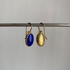 Striking blue Afghanistan lapis lazuli cabochons rest serenely within pristine gold bezels to make an effortlessly regal pairing. 18k yellow gold Lapis lazuli, 9.4ctw, 9mm x 13mm (3/8" x 1/2") Earrings hang 15/16" from the ear Each earring weighs 2.4g 2 Earrings, Newport Ri, Lapis Lazuli, Newport, Vintage Inspired, Fine Jewelry, Product Launch, Yellow Gold, Drop Earrings