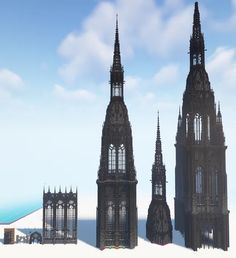 an image of three gothic towers in the snow