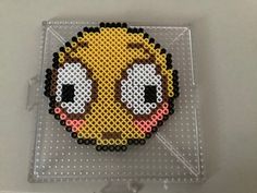 the pixel art is made out of plastic beads