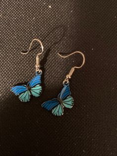 Blue and turquoise butterfly charms, silver fish hook earring wires, rubber earring backs.  These are such nice charms! Really nice quality and weight, with a shiny silver finish and a blue and turquoise enamel detail. They measure 18 x 13mm. Blue Butterfly Charm Dangle Earrings, Blue Dangle Earrings With Butterfly Charm, Blue Enamel Dangle Jewelry, Turquoise Enamel Dangle Earrings, Turquoise Butterfly Sterling Silver Jewelry, Blue Butterfly Sterling Silver Jewelry, Nickel-free Blue Enamel Jewelry, Nickel-free Adjustable Butterfly Earrings, Blue Enamel Hypoallergenic Jewelry