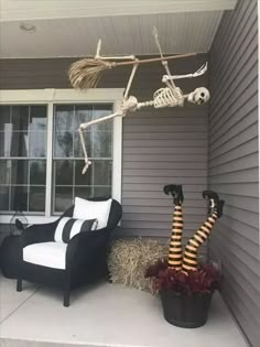 skeleton decorations on the front porch for halloween