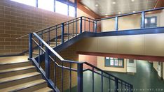 the inside of a building with stairs and windows