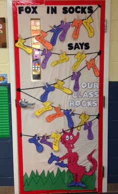 a classroom door decorated with posters and magnets