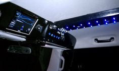 the interior of a vehicle with blue lights